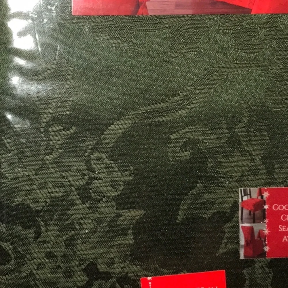 Damask Christmas Ribbon tablecloth. Size 52 x 70 oblong . Color is green